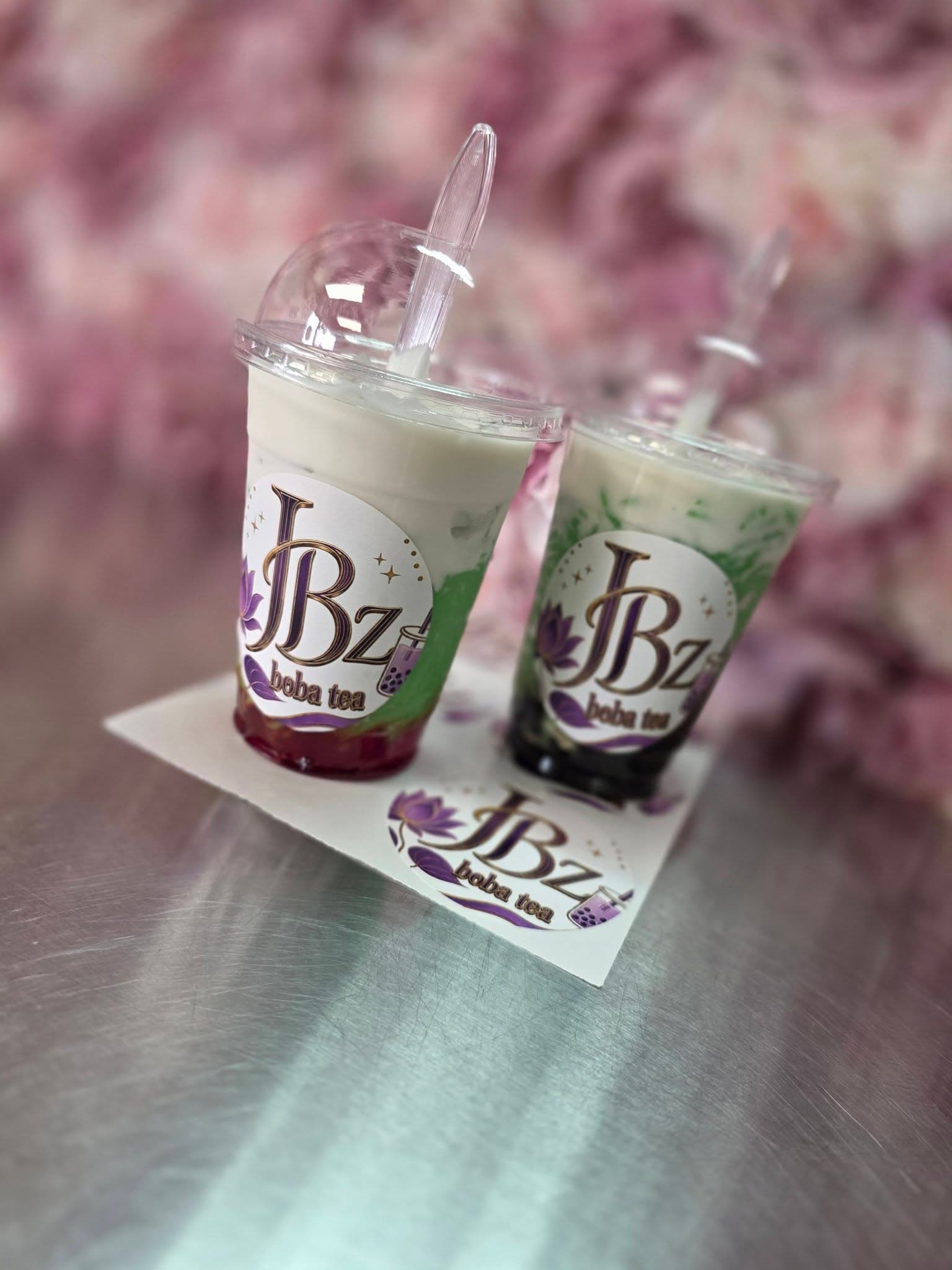 Two JBz fruit teas styled with flowers
