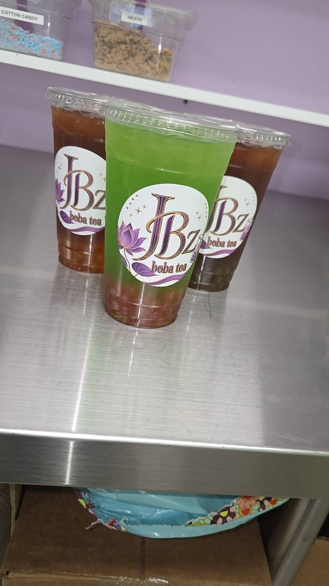 A matcha green and a brown sugar JBz drink together