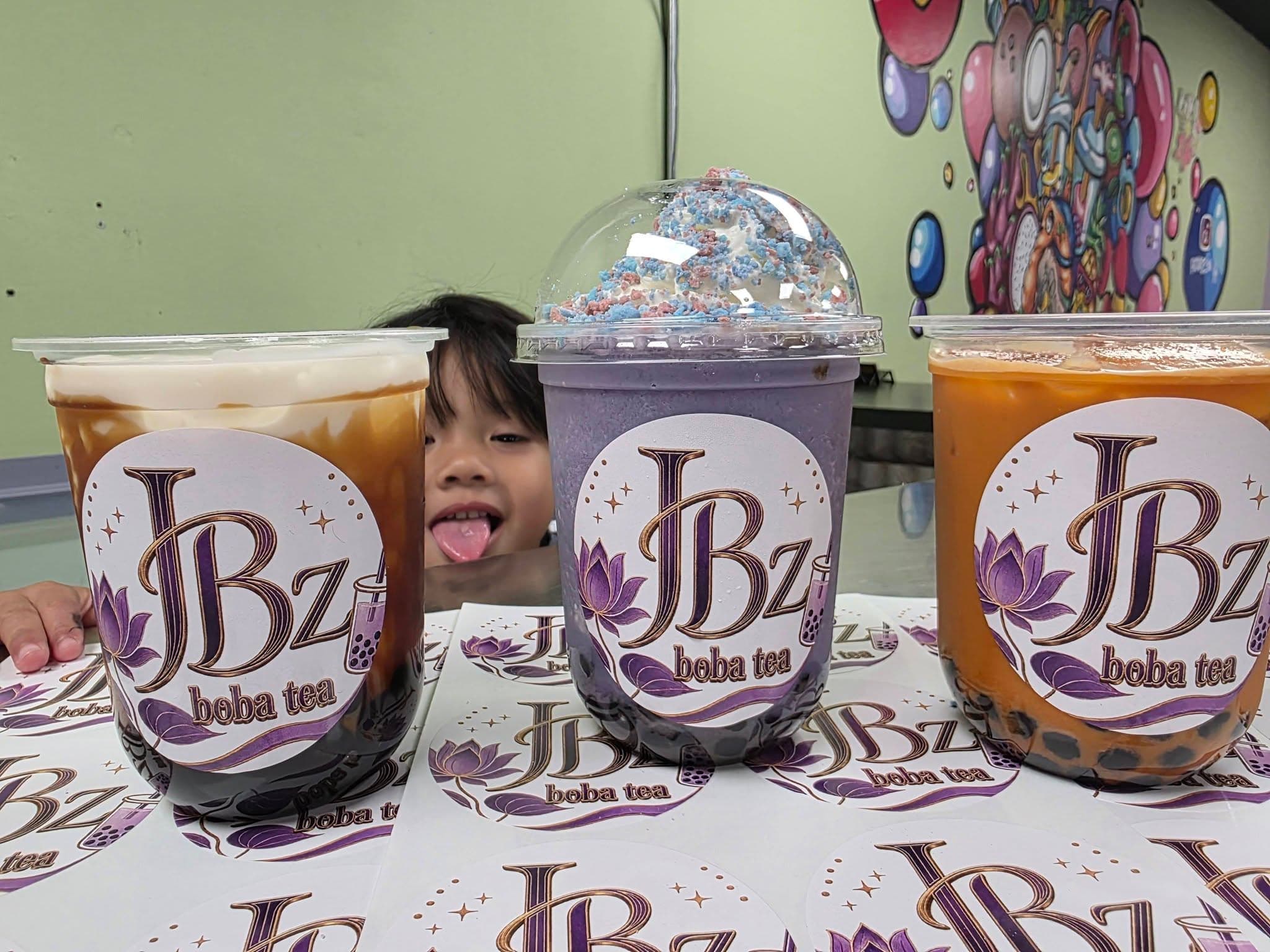 A trio of JBz drinks including a taro whip topped with cereal crunch