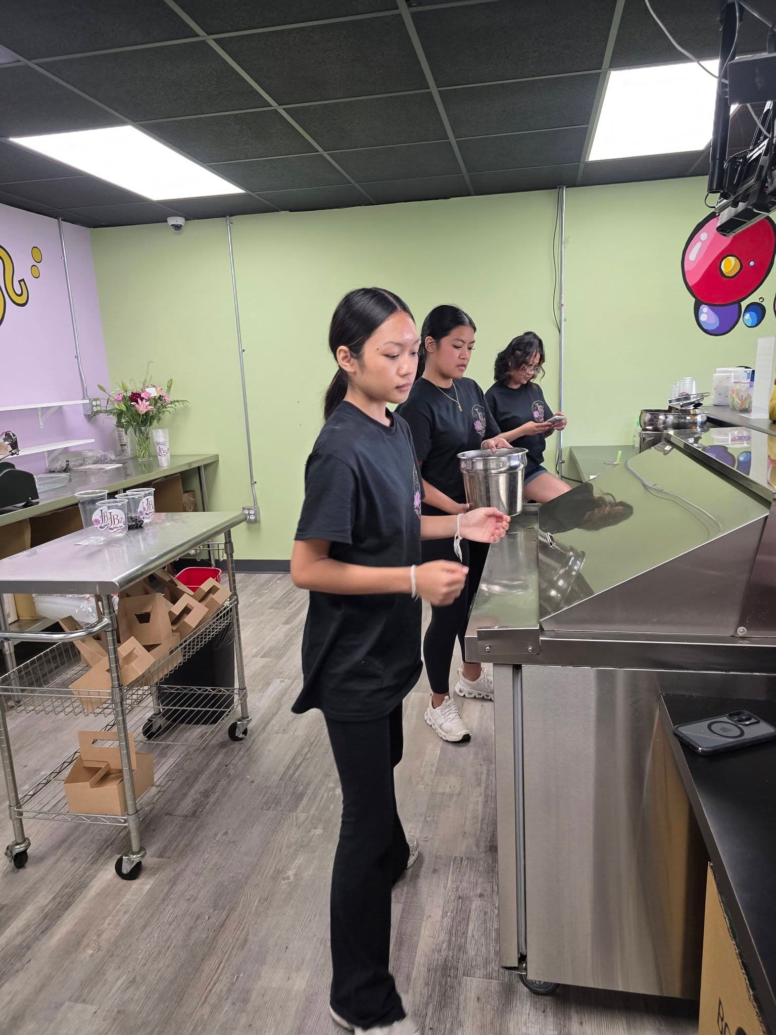 A JBz team member making a drink to order