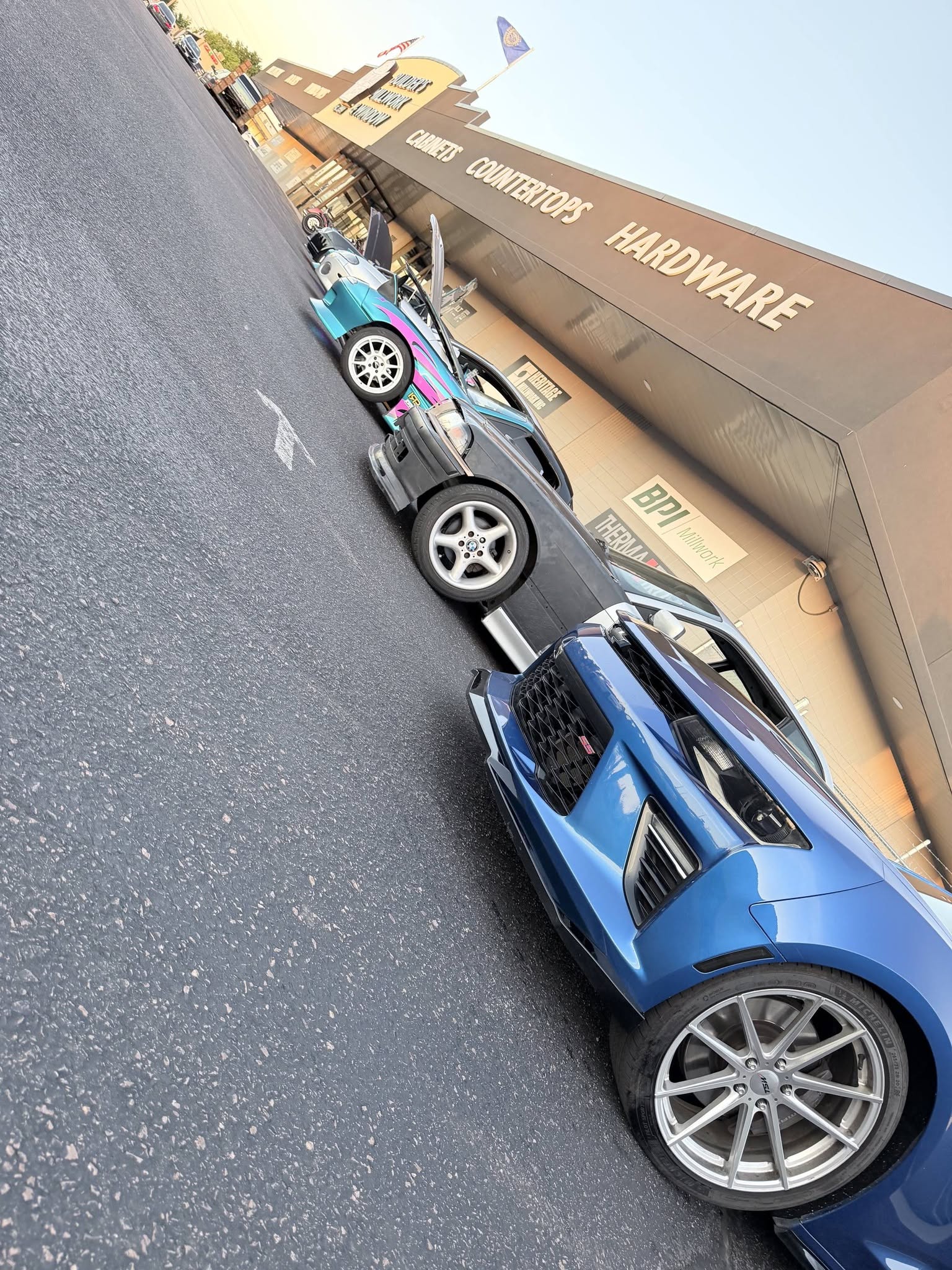 A blue sports car parked at the JBz meet