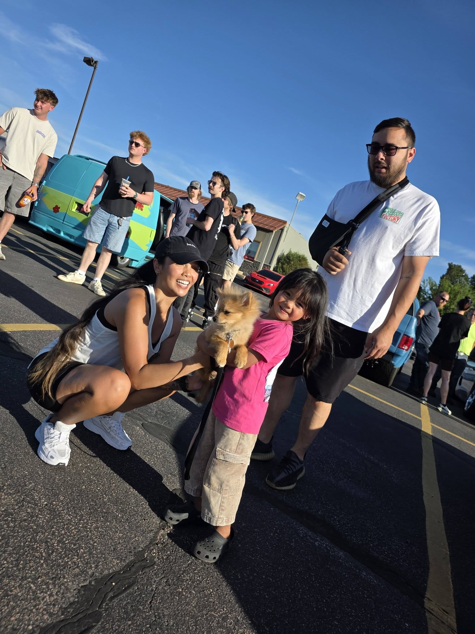 A family and their dog hanging out at the meet