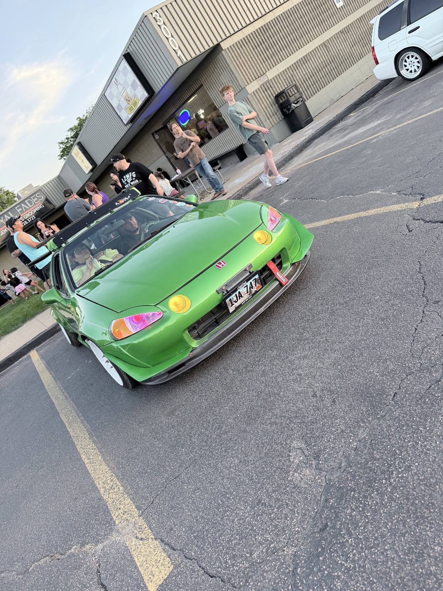 A clean green build parked up at the car meet