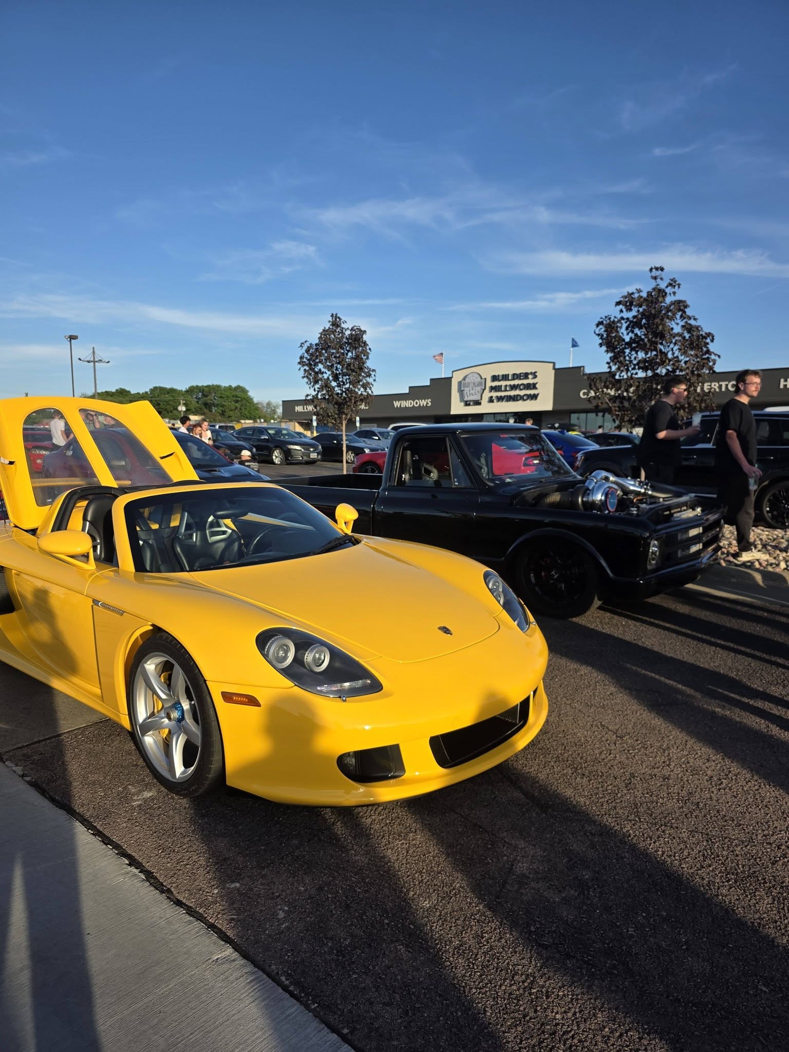 A bright yellow sports car at the meet