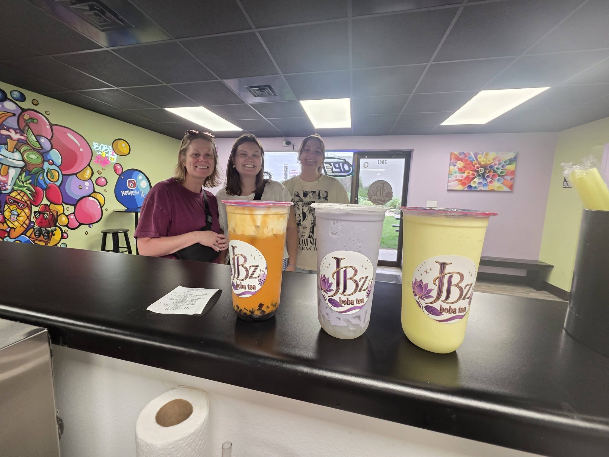 A bright orange and a sunny yellow JBz tea on the counter